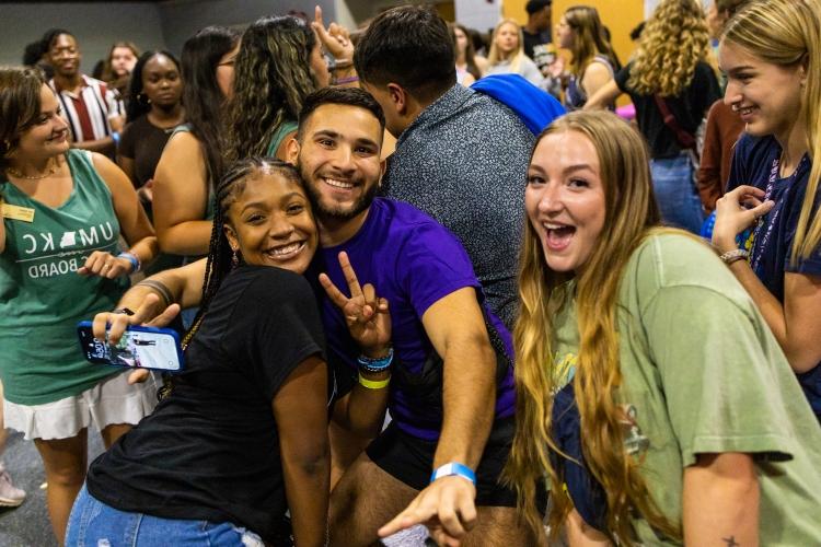 students smile at late night with the Greeks