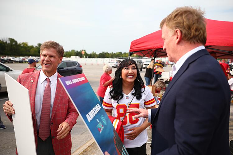 UMKC School of Medicine alumna Amy Patel with NFL Commissioner Rogerl Goodell and Kansas City Chiefs owner Clark Hunt.
